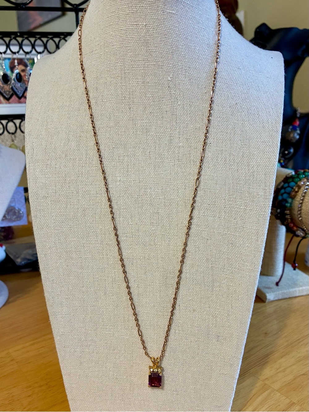 Dainty purple stone pendant necklace.